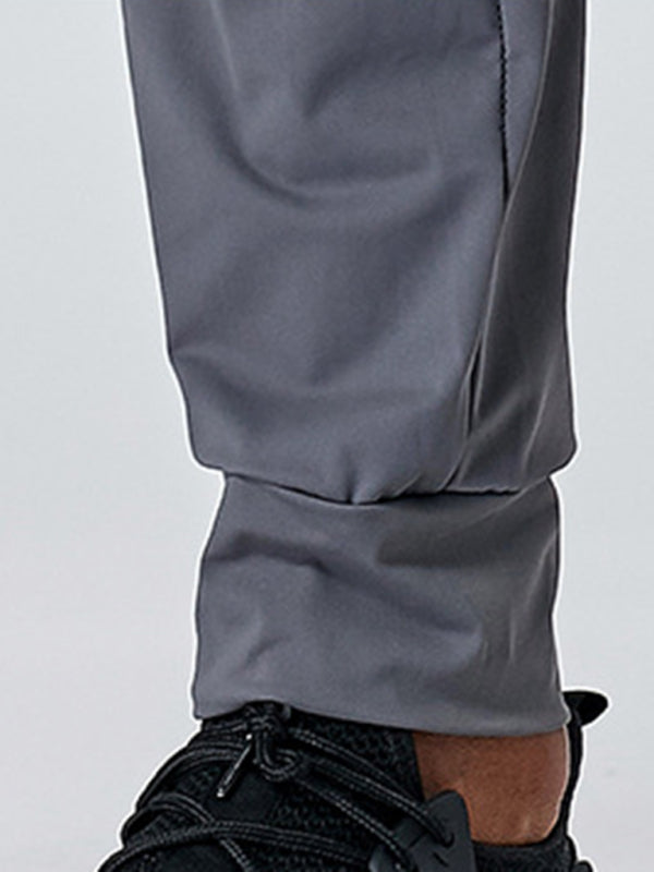 Mans vinnig-droog fiksheid elastiese rits broek