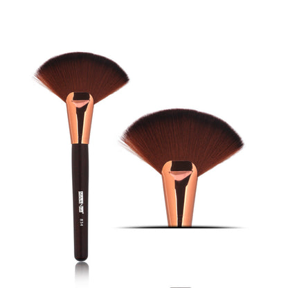 Single large fan blush brush with wooden handle