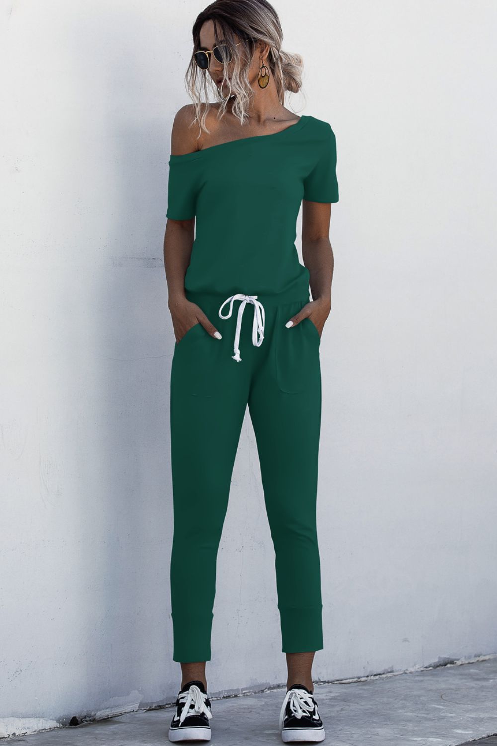 Asimmetriese nek-gebind jumpsuit met sakke