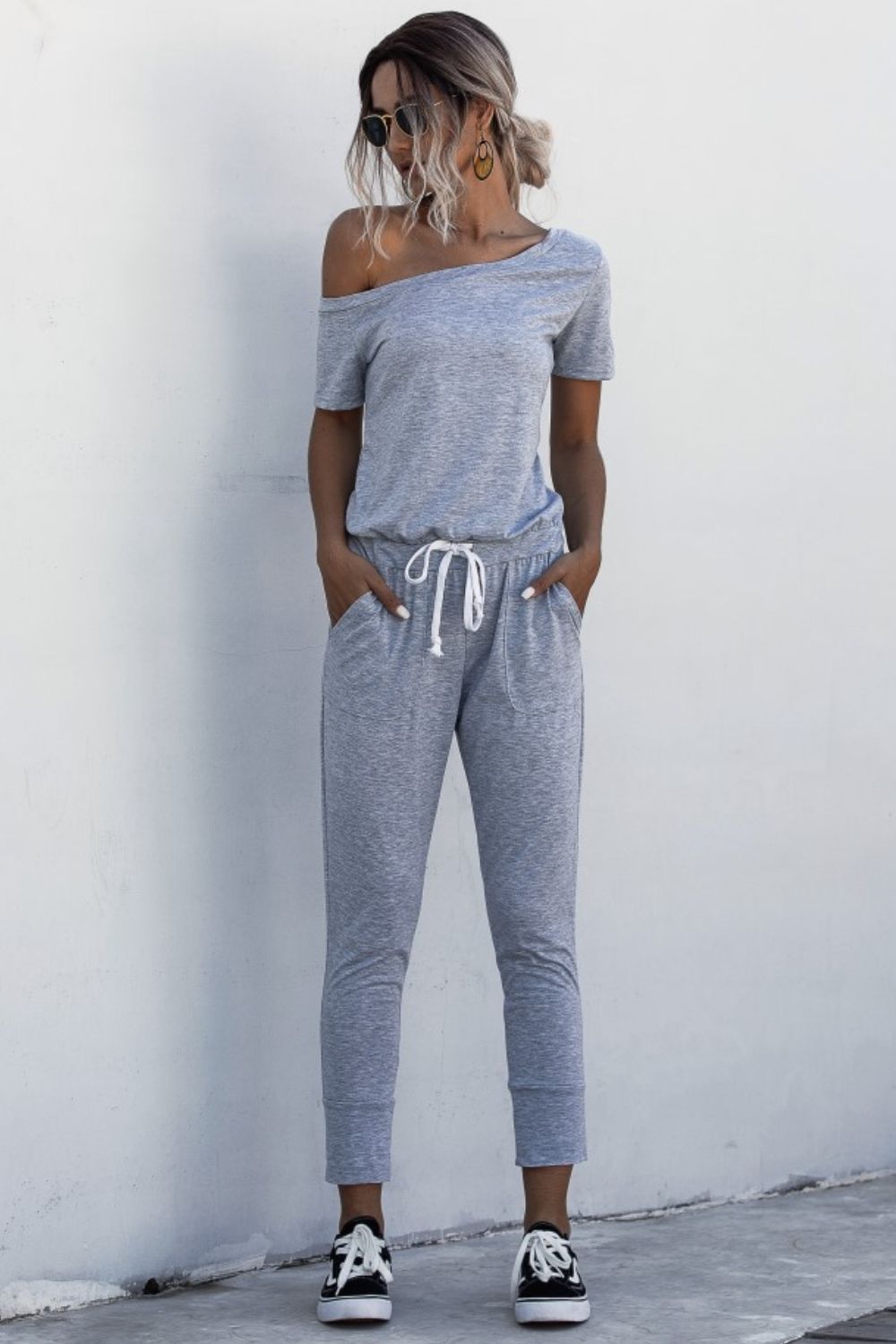 Asimmetriese nek-gebind jumpsuit met sakke