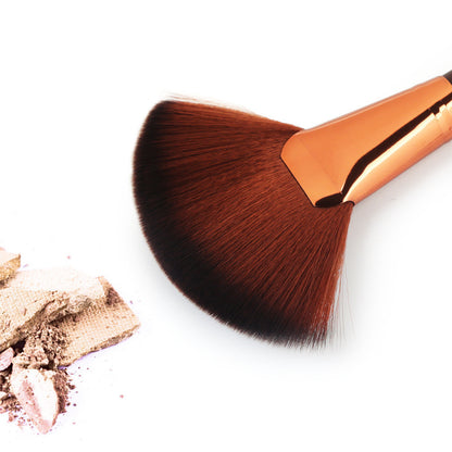 Single large fan blush brush with wooden handle