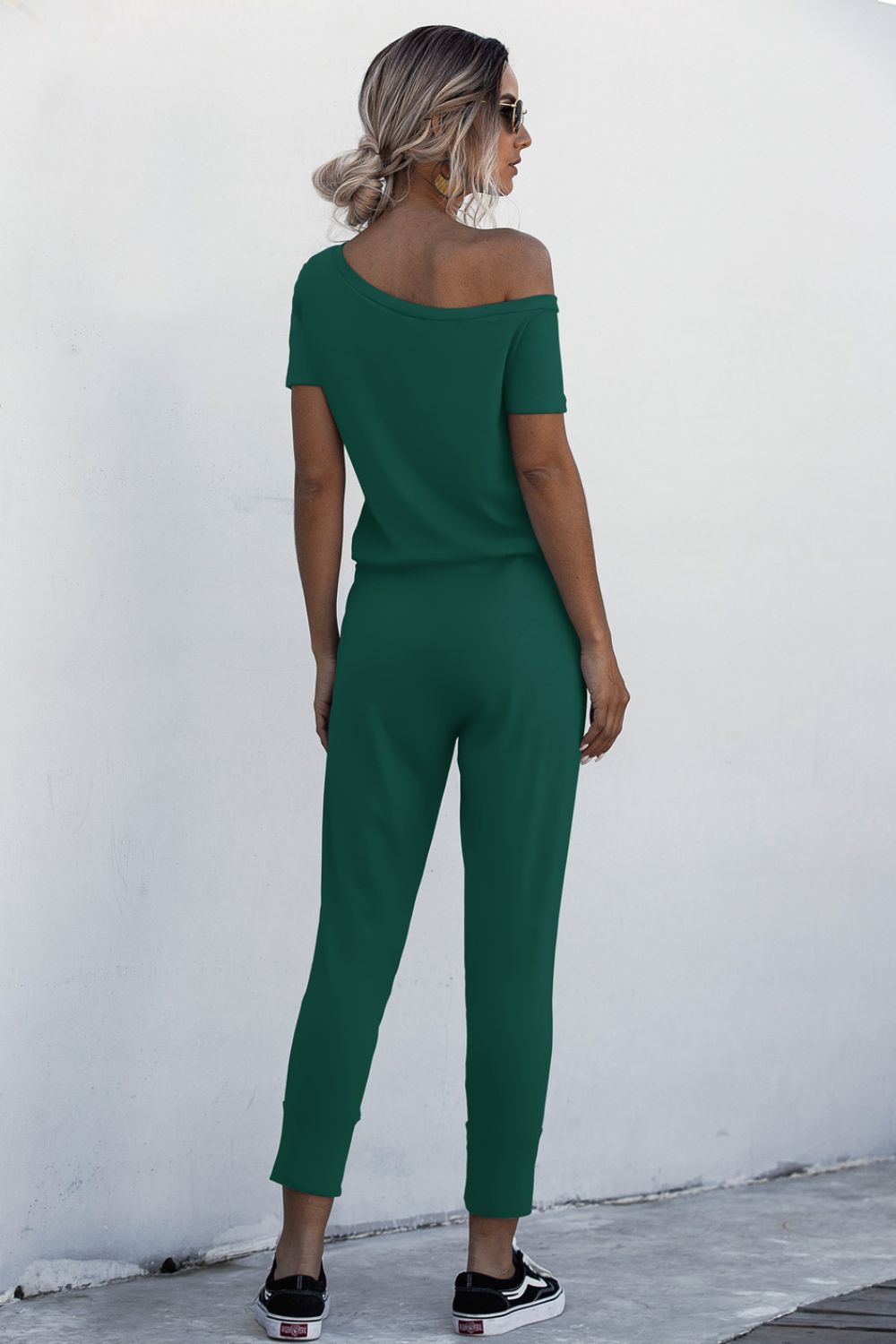 Asimmetriese nek-gebind jumpsuit met sakke