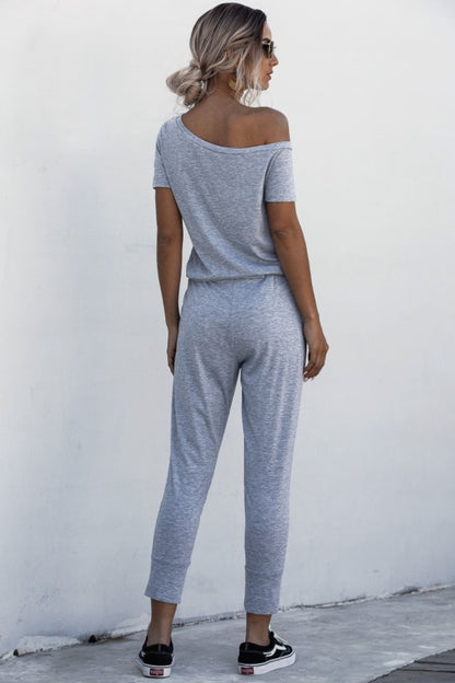 Asimmetriese nek-gebind jumpsuit met sakke