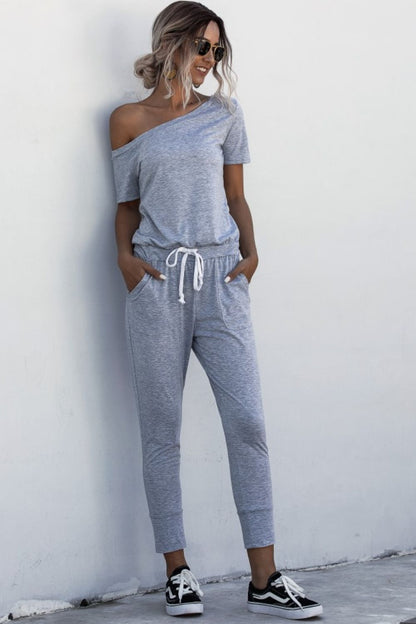 Asimmetriese nek-gebind jumpsuit met sakke