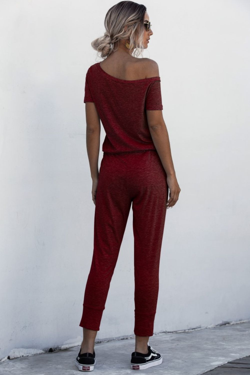 Asimmetriese nek-gebind jumpsuit met sakke